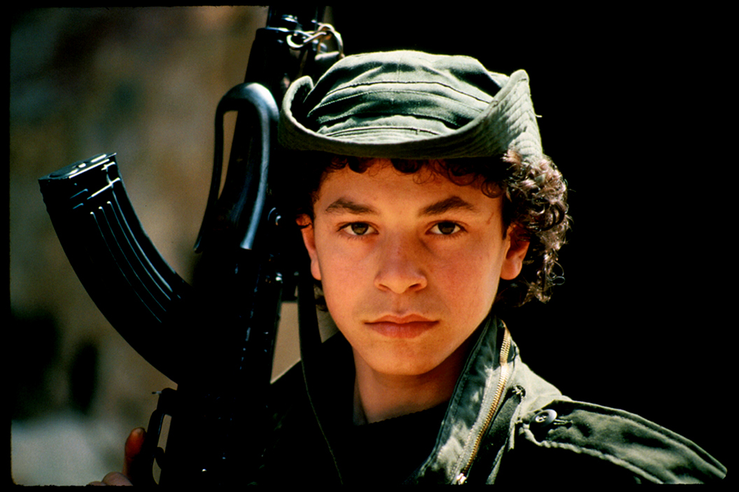 "Bird" 15 year old fighter with AK-47 rifle, West Beirut 1985. : Lebanon 1981-2008 : BILL FOLEY 