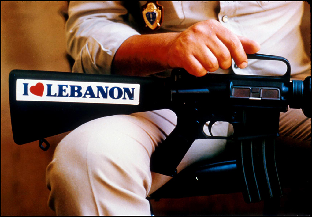 Lebanese policeman holds M-16 rifle at Parliament Building.Beirut 1984 : Lebanon 1981-2008 : BILL FOLEY 