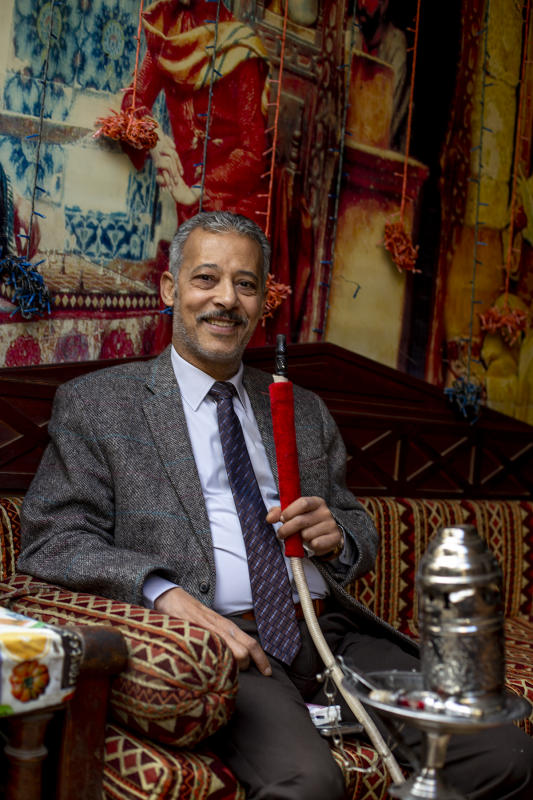 Mr. Hasan enjoys his pipe in Cairo cafe December 2018 : Egypt 1978-2018 : BILL FOLEY 
