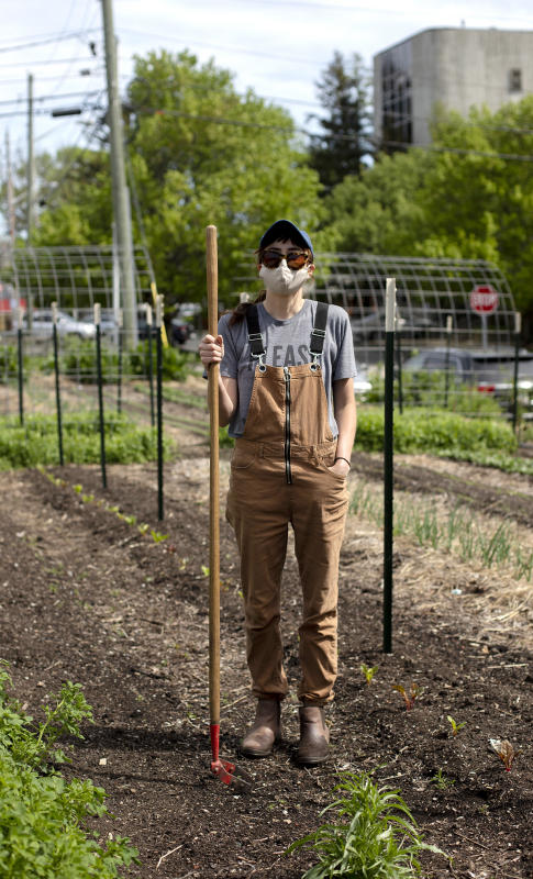Kate takes a short break while tending to her garden on the monon trail, Indianapolis 2020. : Portraits in a Pandemic-Masks on! : BILL FOLEY 