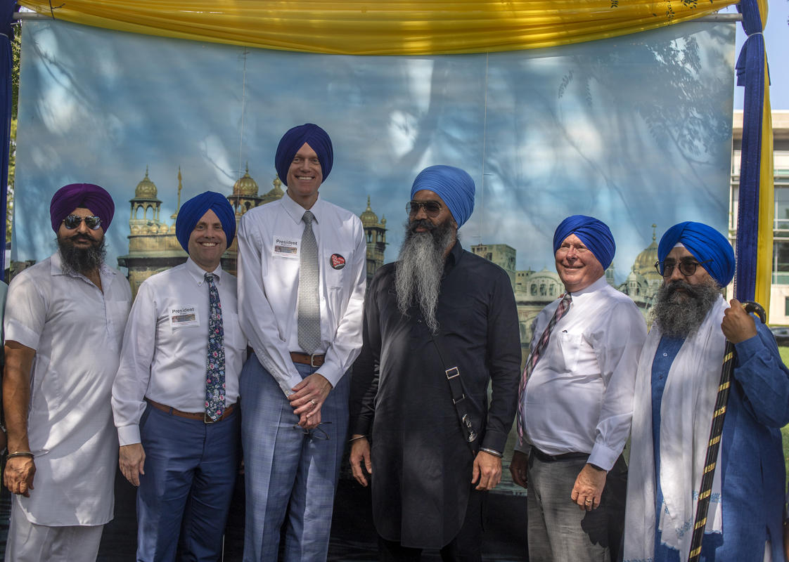 Sikhs and Mormons exchange ideas and traditional Sikh headdress. : Festival of Faith, Back in Person! 2022. Military Park Downtown, Indianapolis, September 18, 2022! And Festival of Faith Pre-Pandemic 2019! : BILL FOLEY 
