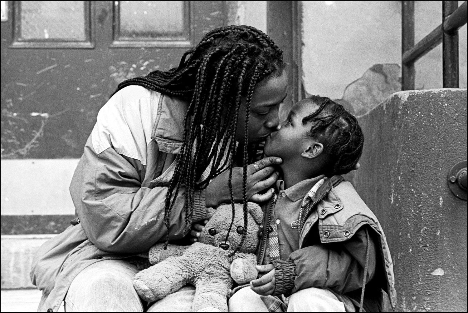 Oh Mom! Young boy is kissed by Mom.  : Carmel Hill Harlem NYC 1995-2000 : BILL FOLEY 