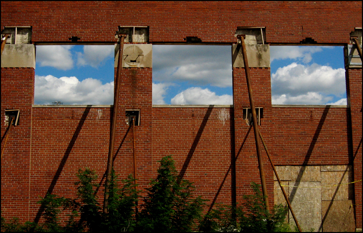 Clouds through the stadium walls, shadows of supports show on the brick walls. 2012 : Bush Stadium 2012 : BILL FOLEY 