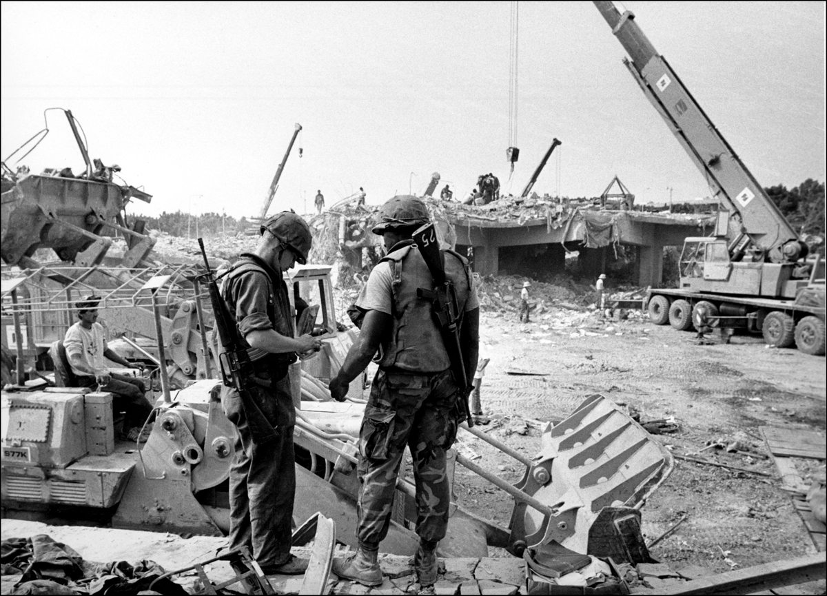 Two Marines look at items found in the rubble of the destroyed Marine base, Beirut,Oct.1983 : USMC in Beirut 1982-1983 : BILL FOLEY 