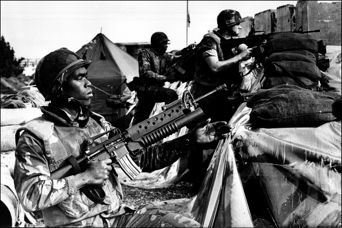 On Alert, US Marines weapons at the ready as they observe the perimeter of the Marine base, Beirut Airport. 1983 : USMC in Beirut 1982-1983 : BILL FOLEY 