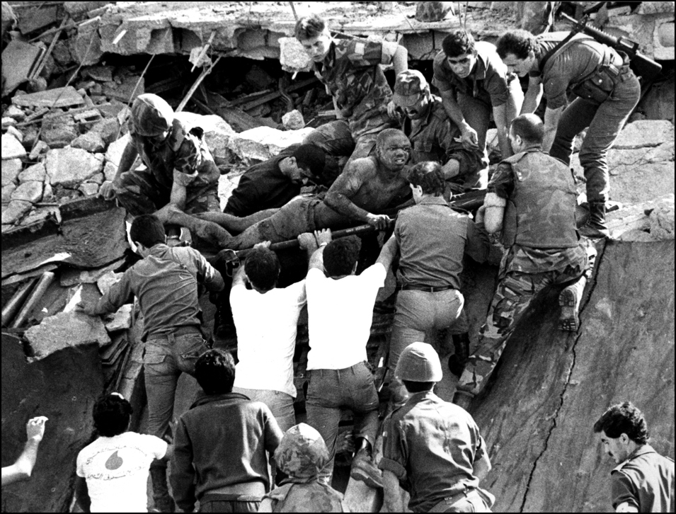 Survivor-US Marine lifted from the rubble of the Marine HQ at Beirut airport after it was destroyed by a truck bomb. Oct. 23, 1983 : USMC in Beirut 1982-1983 : BILL FOLEY 