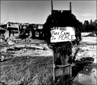 Beirut Dec. 1983, "24th MAU They came in Peace" note and Christmas wreath decorate a stretcher at the site of the destroyed US Marine HQ at Beirut airport.  - © 2023 Bill Foley. All Rights Reserved.