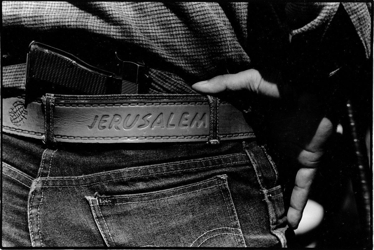 PLO Fighter, with pistol and belt engraved with "Jerusalem" and a handgrenade. Chtaura, Bekaa Valley, Lebanon 1983. : Lebanon 1981-2008 : BILL FOLEY 