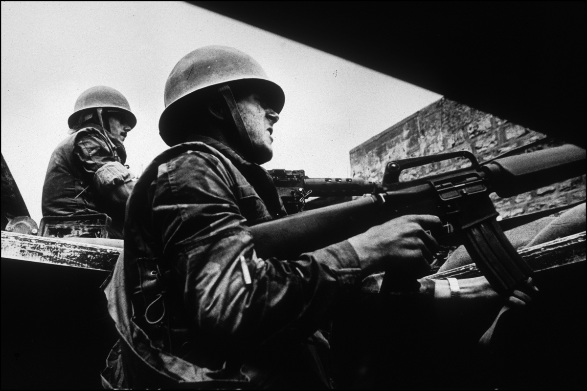 Lebanese Army soldiers shoot their M-16's at Druse fighters from their APC.  Chouf War, Lebanon. : Lebanon 1981-2008 : BILL FOLEY 