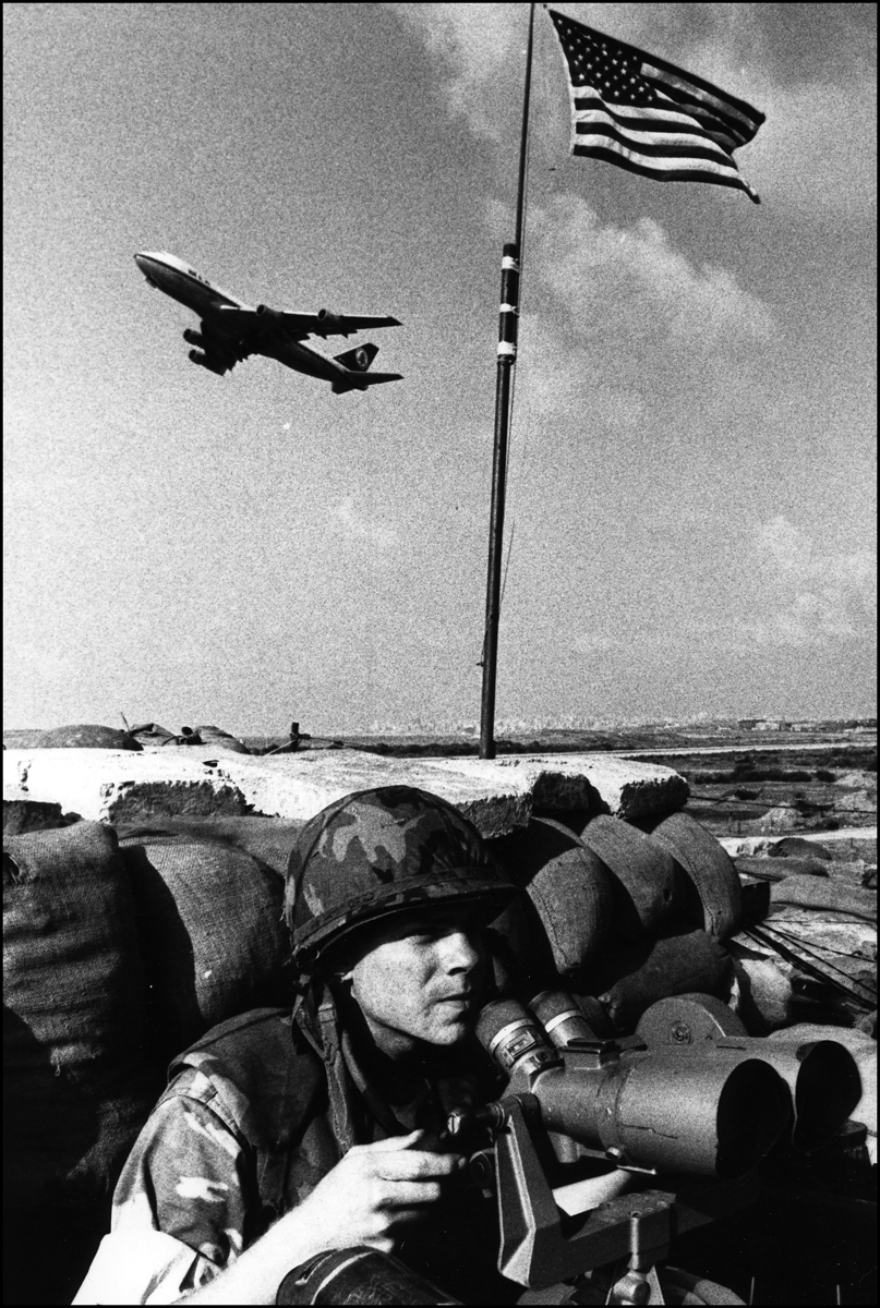 Marine keeps watch, Beirut Airport, MEA jet takes off. 1983. : USMC in Beirut 1982-1983 : BILL FOLEY 