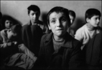 Young child looks lost, mental asylum, Albania 1992 - © 2023 Bill Foley. All Rights Reserved.