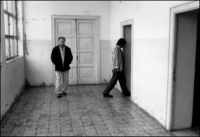 Guys Pace in mental asylum, Elbasan, Albania1992 - © 2023 Bill Foley. All Rights Reserved.