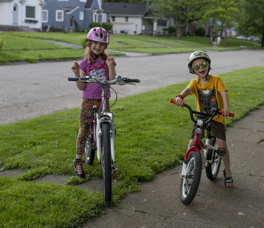 Kids smile as they clown around on their bicycles. : Observations in a Pandemic 2020-2021 : BILL FOLEY 