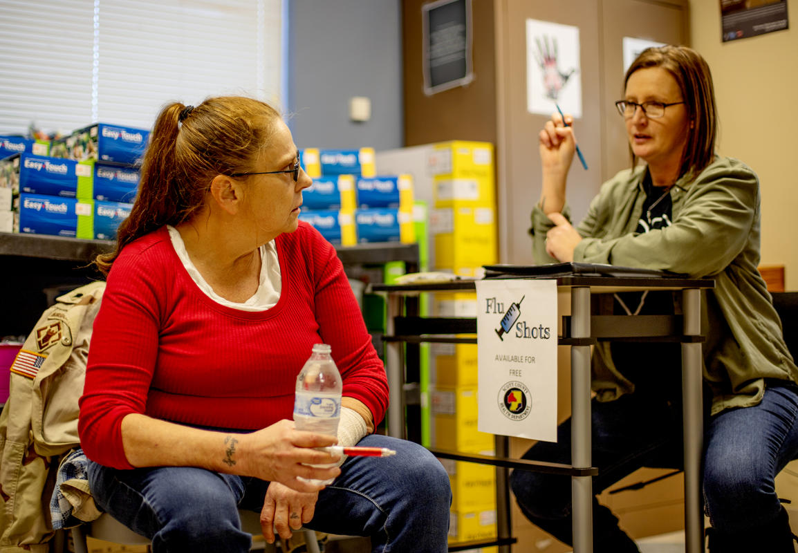 Kay White listens to Lisa Webster as she tells Kay her options. : FIX Heartbreak and Hope inside Indiana's opioid crisis-Portraits of Recovery : BILL FOLEY 