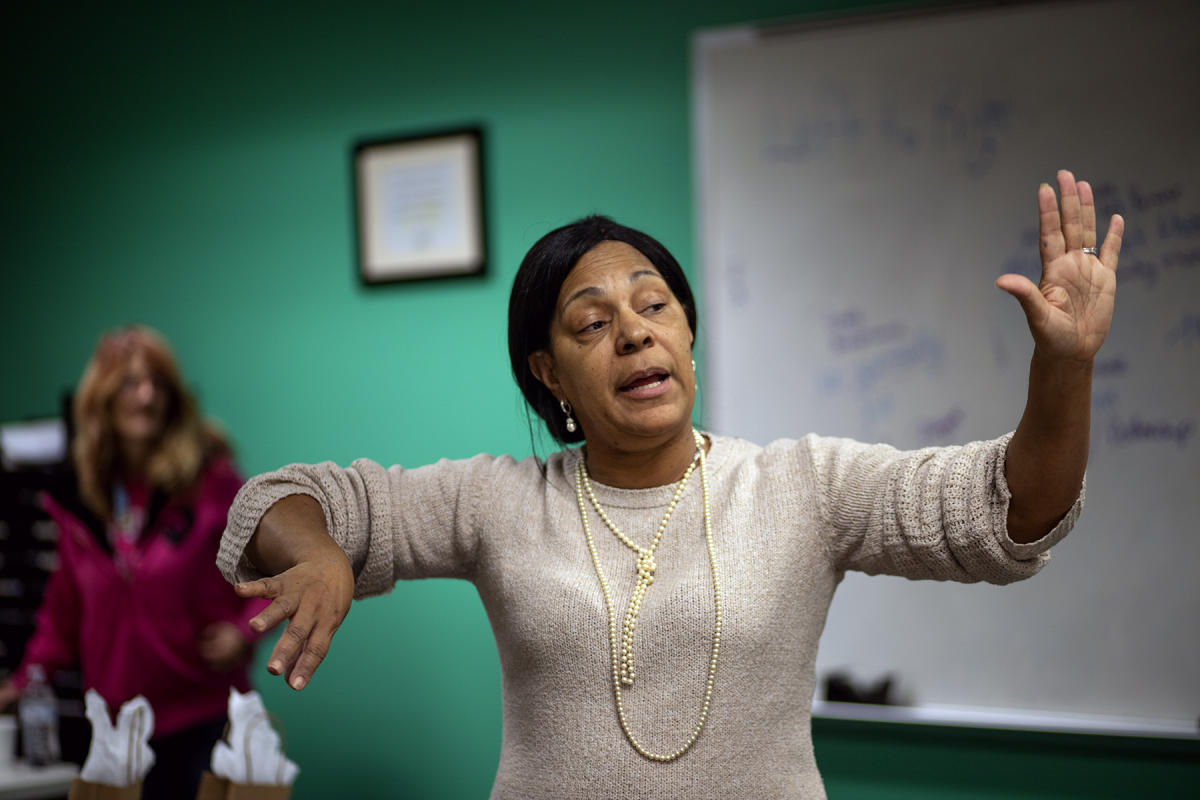 Gina Fears, in recovery, gestures during a meeting at Pace in Indianapolis. : FIX Heartbreak and Hope inside Indiana's opioid crisis-Portraits of Recovery : BILL FOLEY 