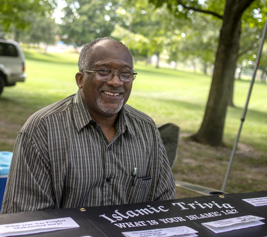 Imam Michael Sahir Smiles as he runs Islamic Trivia game at the 2022 Festival of Faiths. : Festival of Faith, Back in Person! 2022. Military Park Downtown, Indianapolis, September 18, 2022! And Festival of Faith Pre-Pandemic 2019! : BILL FOLEY 